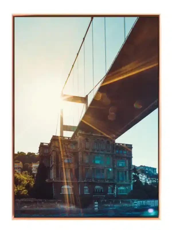 Sunlit Bridge Over Historic Building